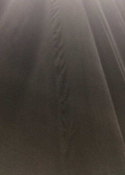 washed curtains showing pulled seams